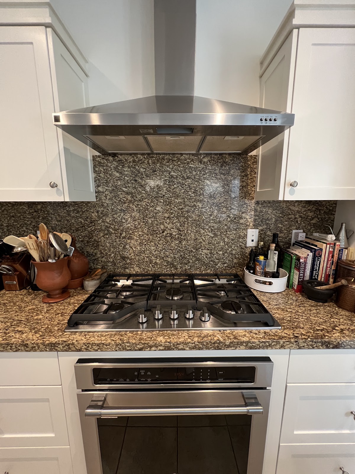 Kitchen with stove and countertop decor.