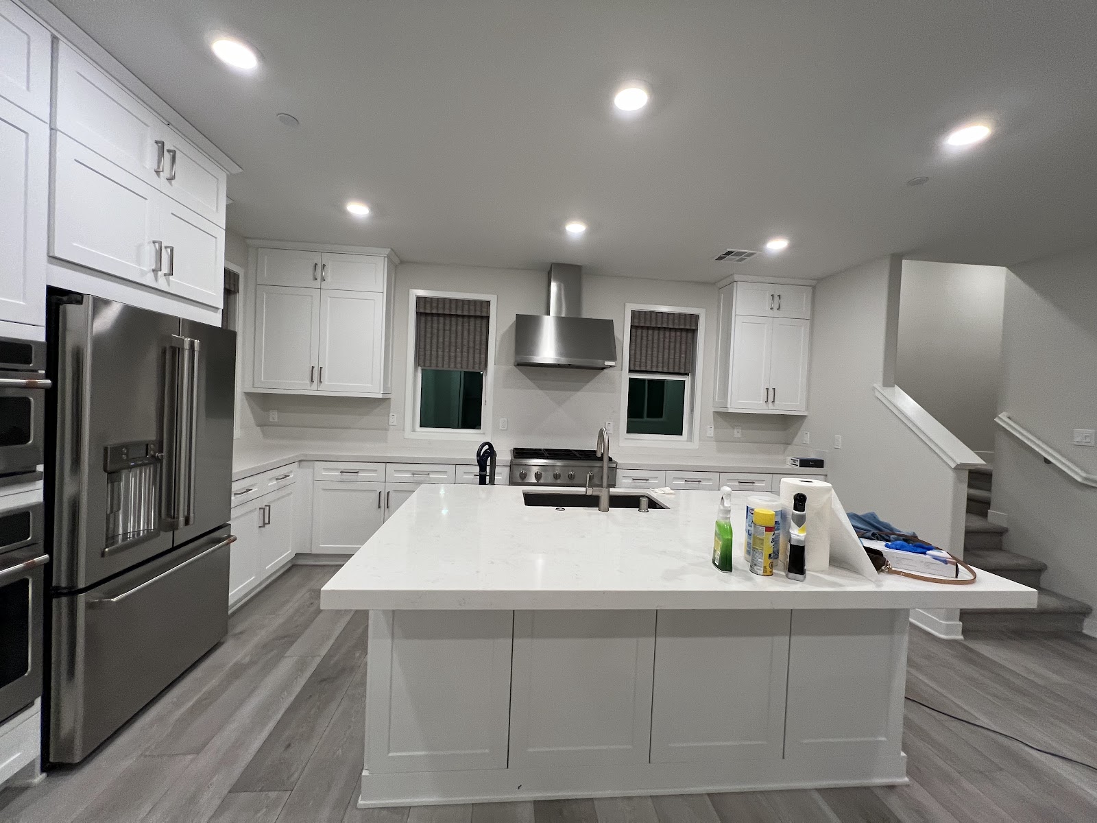 Modern kitchen with a large island and appliances.